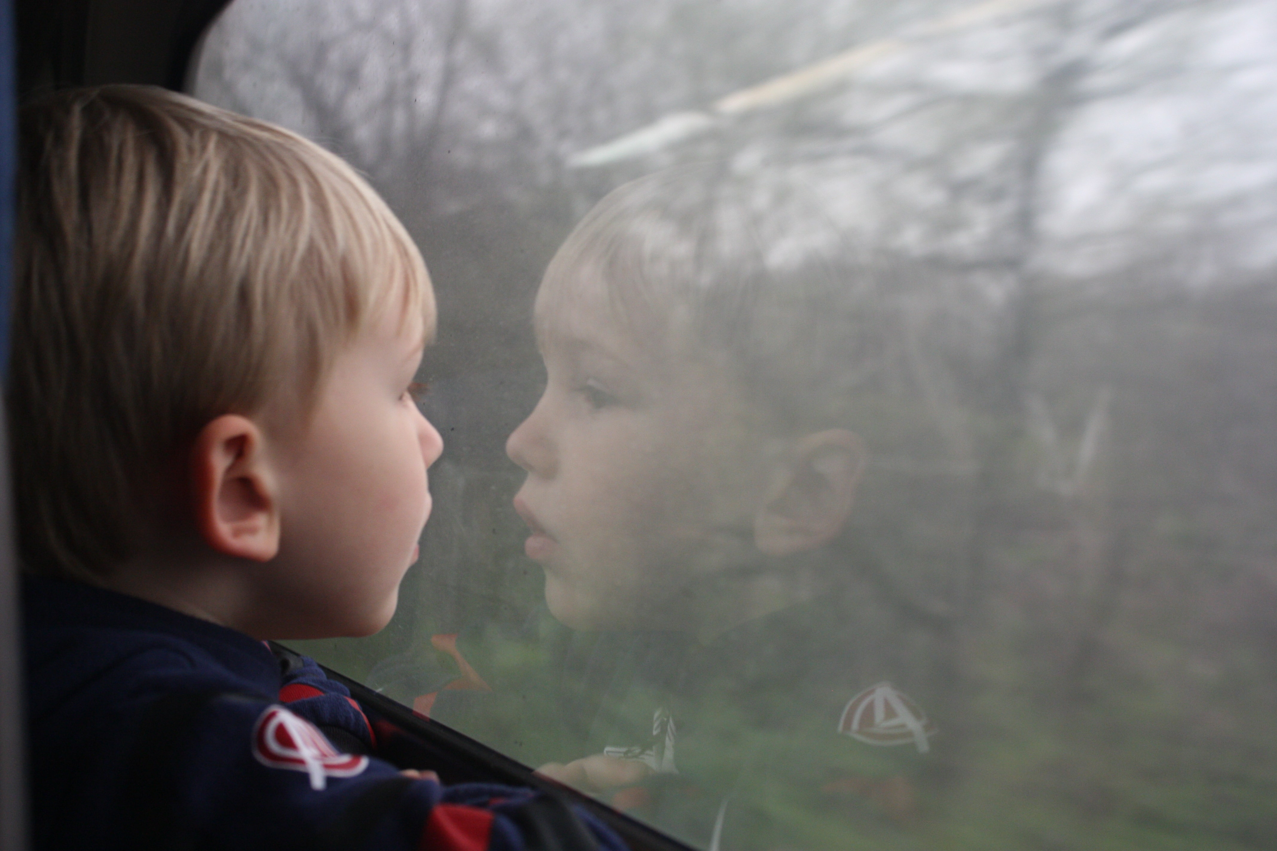 boy looking out of train window