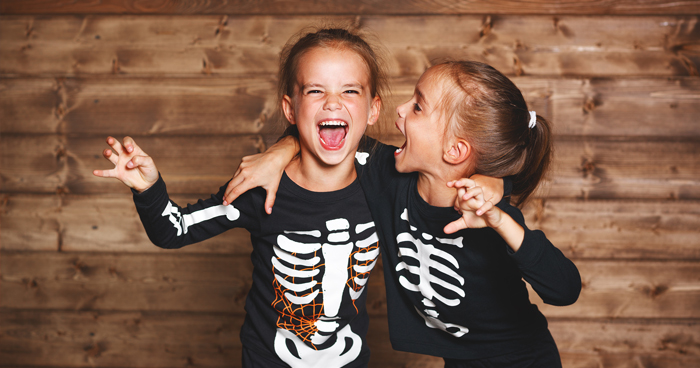 Girls laughing in Halloween costumes